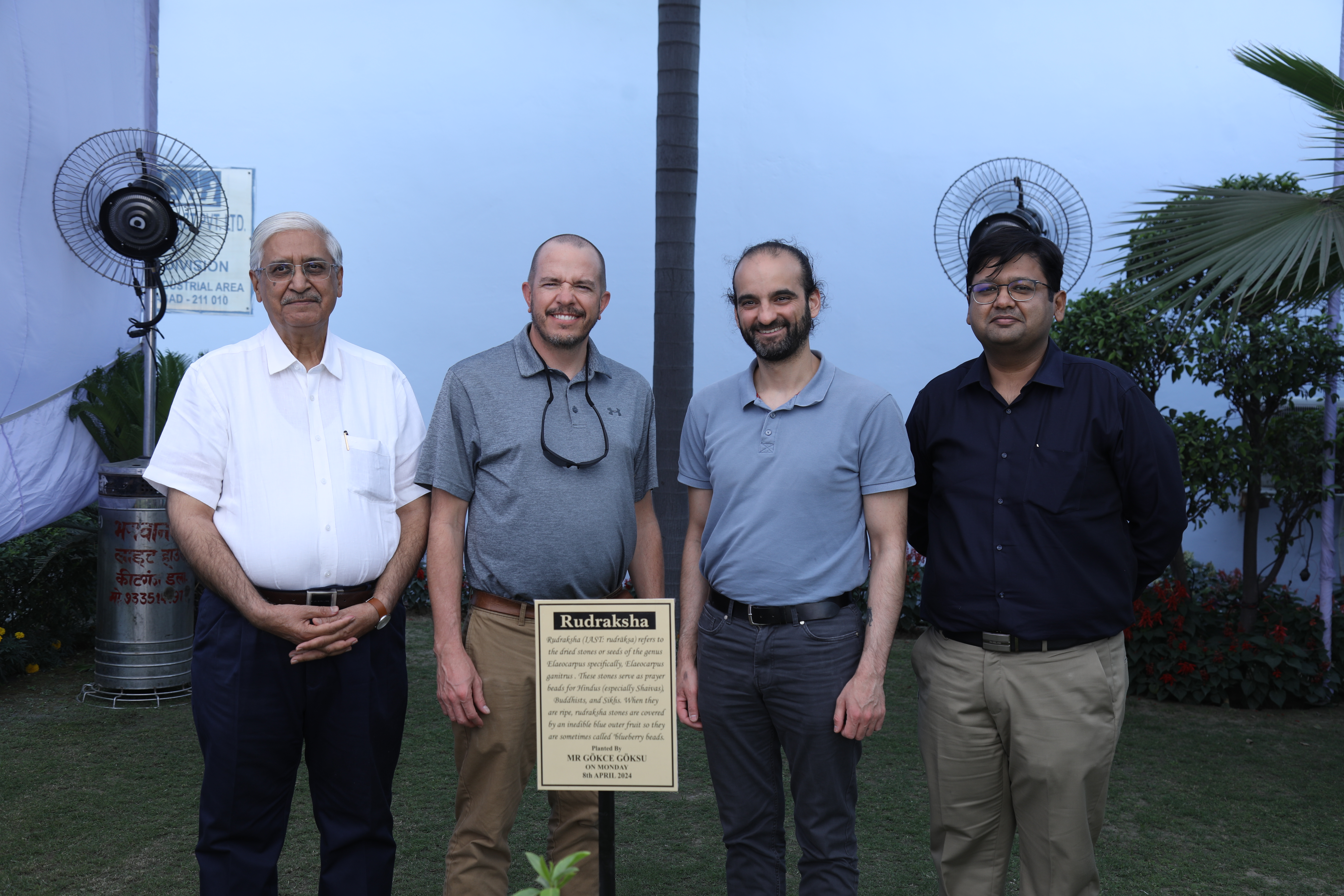 Triveni leadership and guests beside the Rudraksha tree planted on Environment Day